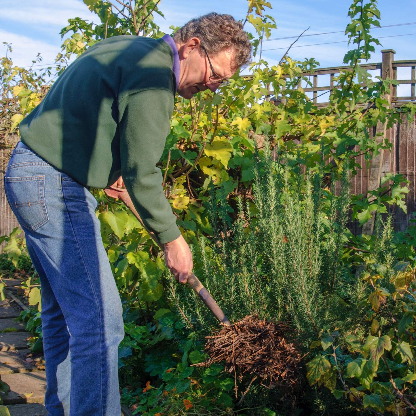 FREE TALK: Organic Gardening, with Nick Hamilton. November 2024. Nick Hamilton adding organic matter to a border.