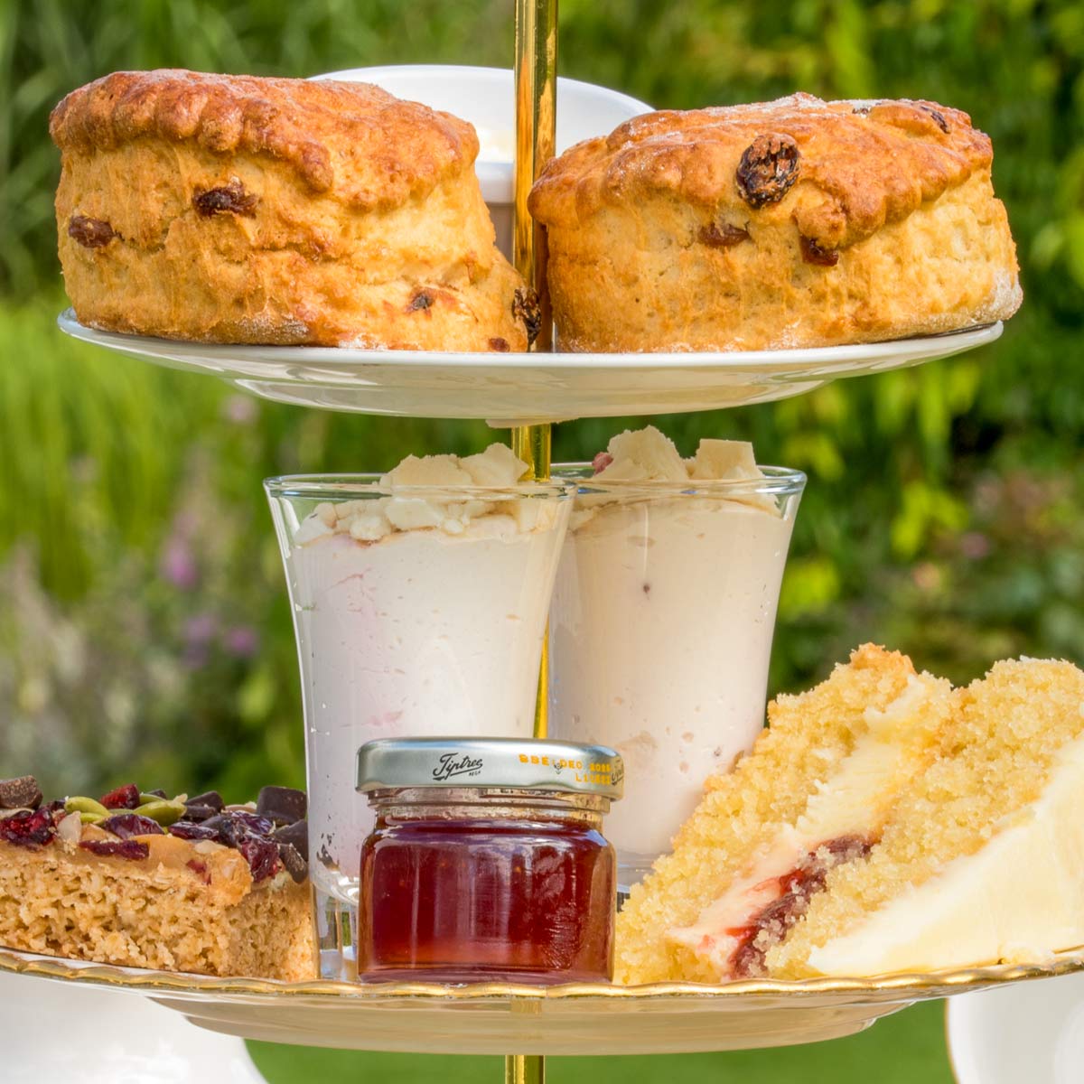 Barnsdale Afternoon Tea. Detail of cake, Eton mess, jam, two homemade scones with pot of clotted cream