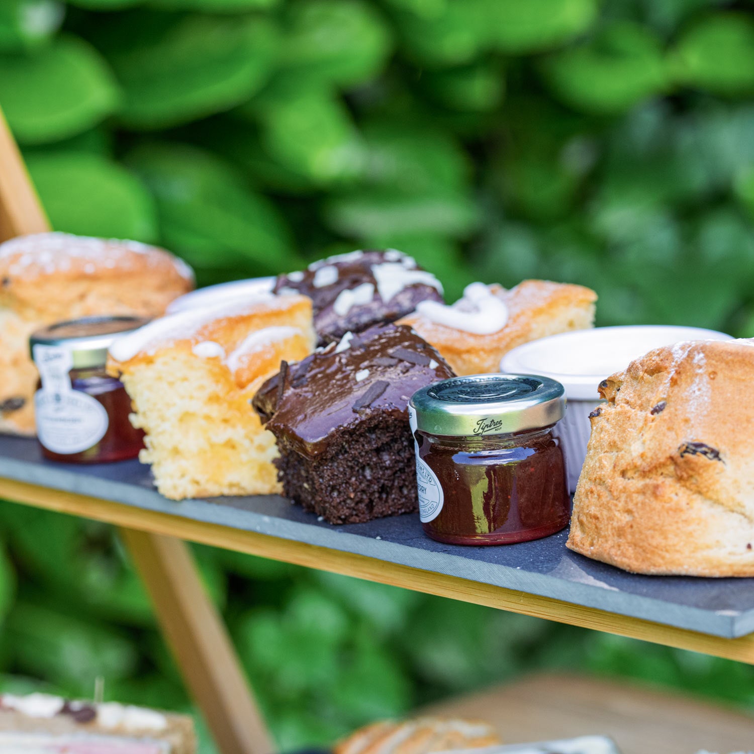 Barnsdale Afternoon Tea from The Helenium Tea Room at Barnsdale Gardens. Assorted pastries and jars of jam