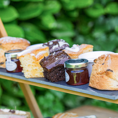 Barnsdale Afternoon Tea from The Helenium Tea Room at Barnsdale Gardens. Assorted pastries and jars of jam