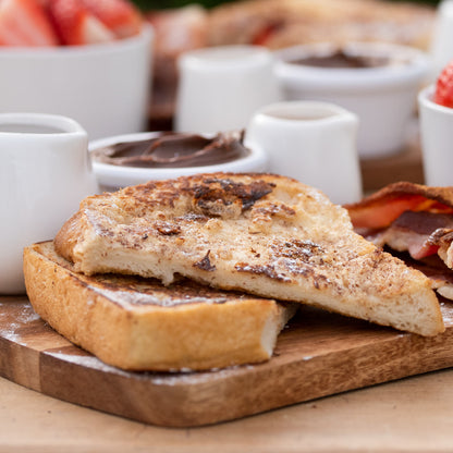 French Toast Sharing Board: French toast; Smoked streaky bacon; Scrambled eggs; Fruit, Nutella; Honey; Maple sauce.