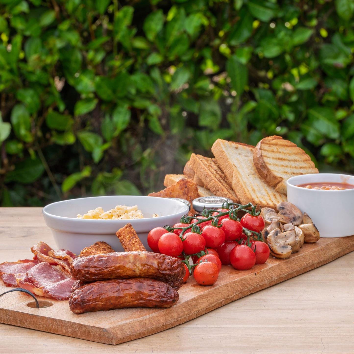 Full English Platter: Smoked bacon; Sausages; Scrambled egg; Mushrooms; Baked beans; Tomatoes on-the-vine; Hash browns; Toast; Jam and Marmalade.