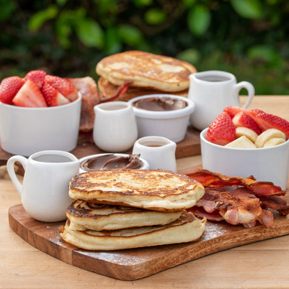 Pancake Sharing Board: American pancakes; Smoked streaky bacon; Fruit; Nutella; Honey; Maple sauce.